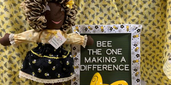 Giving Doll Volunteer